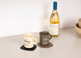 Pacific coaster in Roskin vegan leather with a cup resting on it