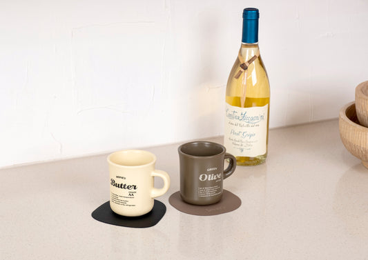 Pacific coaster in Roskin vegan leather with a cup resting on it